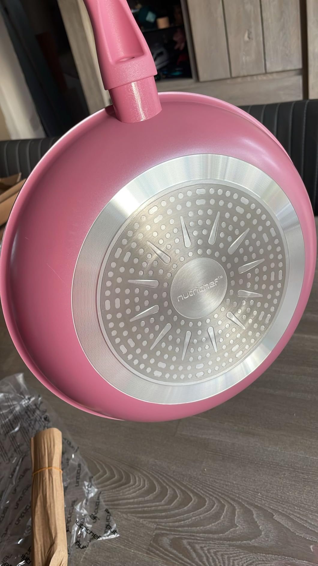 Underside of the pink pan showing the induction base